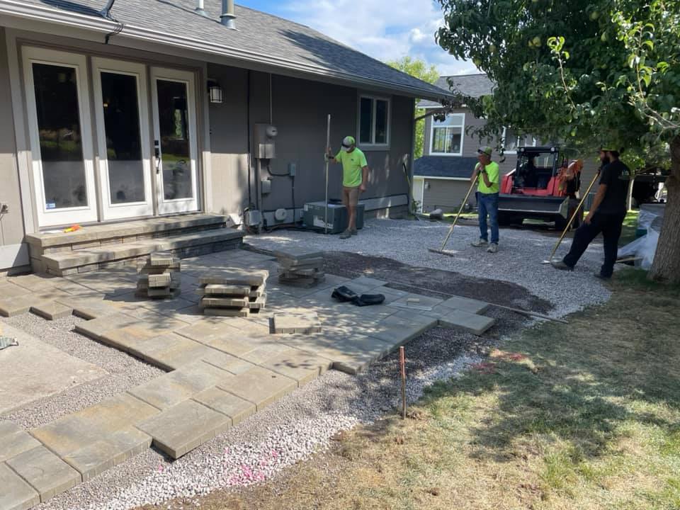 Team members continue with custom stone driveway